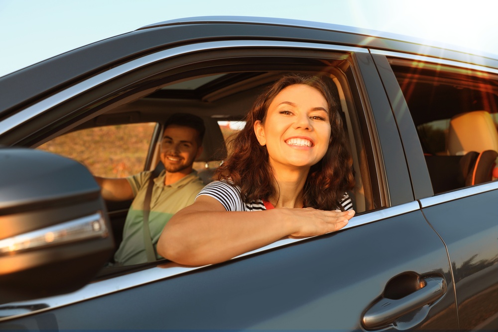 Happy driver enjoying her new vehicle