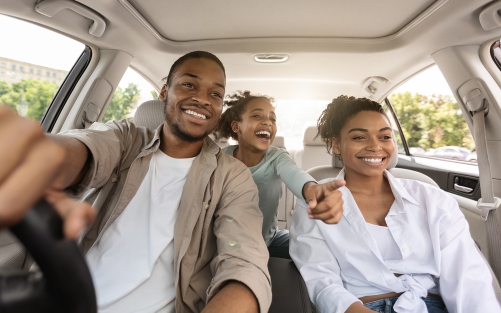 A happy family taking a drive together