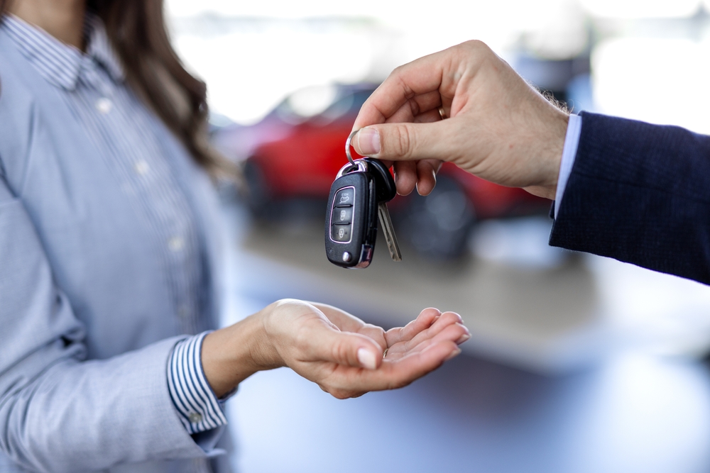 Vehicle keys being handed to their new owner