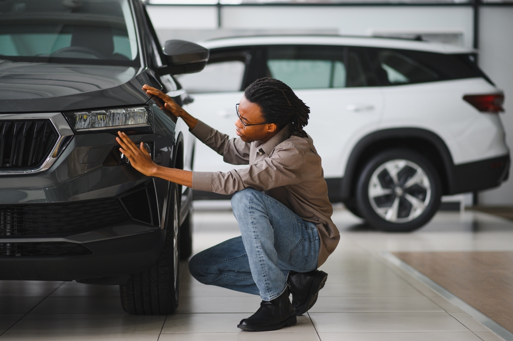 A careful vehicle inspection at a dealership